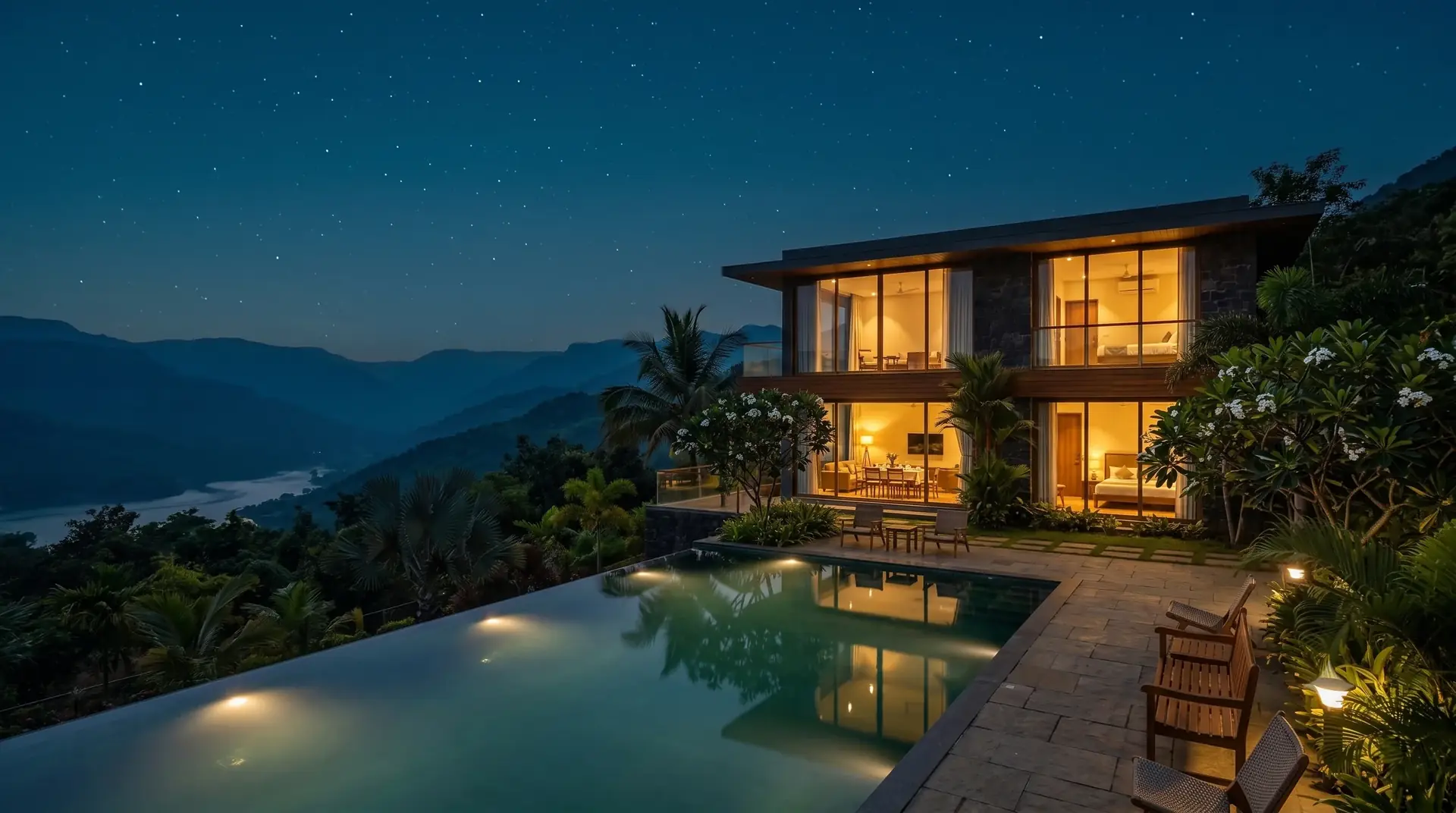 The same villa at night, fully lit, with guests inside (representative property)